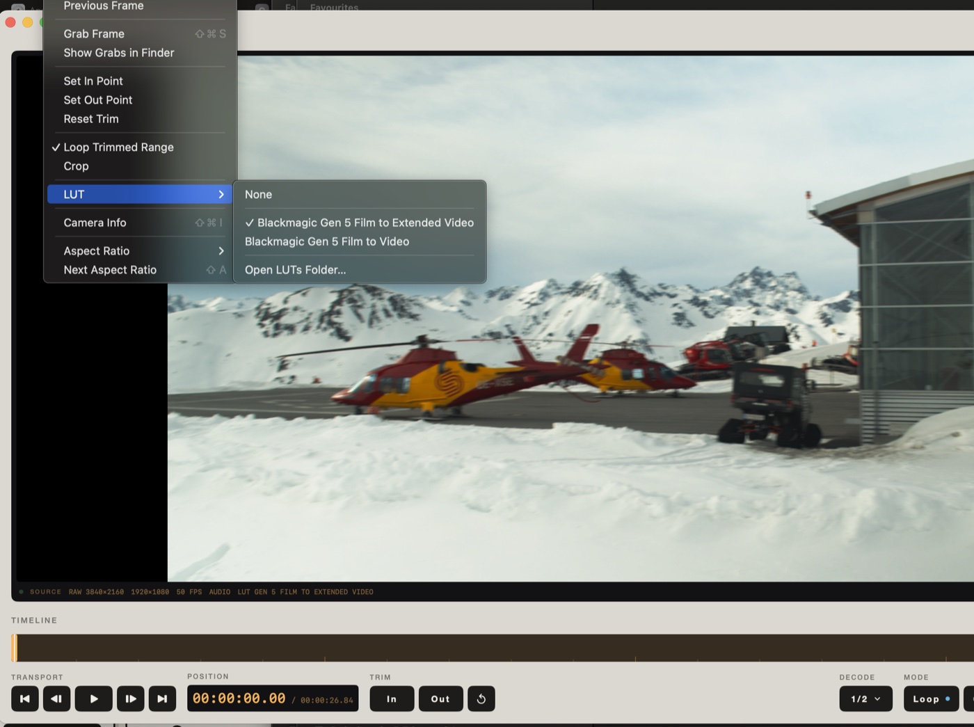A Blackmagic RAW clip of red helicopters on snow, with the LUT menu open showing None, Blackmagic Gen 5 Film to Extended Video, and Gen 5 Film to Video.