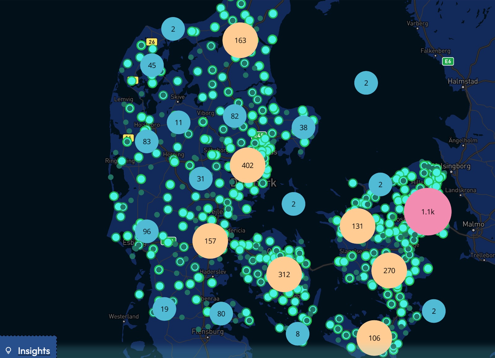 A dark map of Denmark covered in cyan sighting markers, with larger numbered cluster bubbles: 1.1k around Copenhagen, 402 near Aarhus, 312 on Funen, 270 and 131 on Zealand.